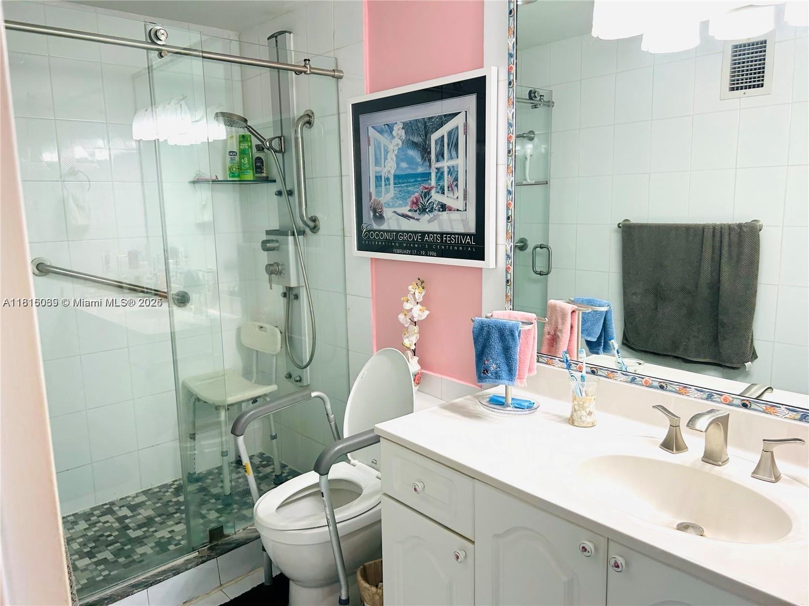 Corinthian Condominiums Miami Beach, FL 33140 - Photo 12 of 19 a bathroom with a sink toilet and shower