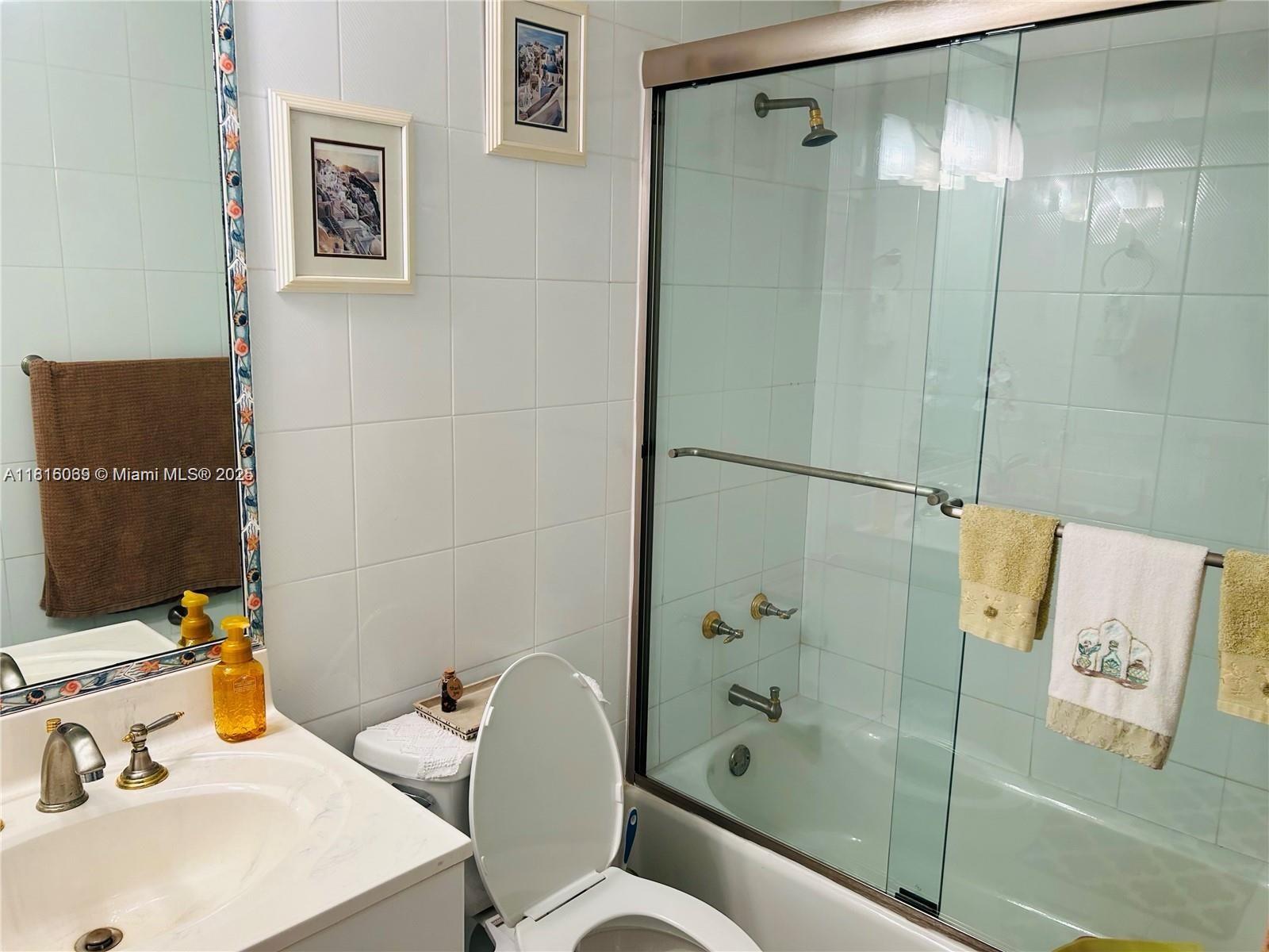 Corinthian Condominiums Miami Beach, FL 33140 - Photo 13 of 19 a bathroom with a sink toilet and shower