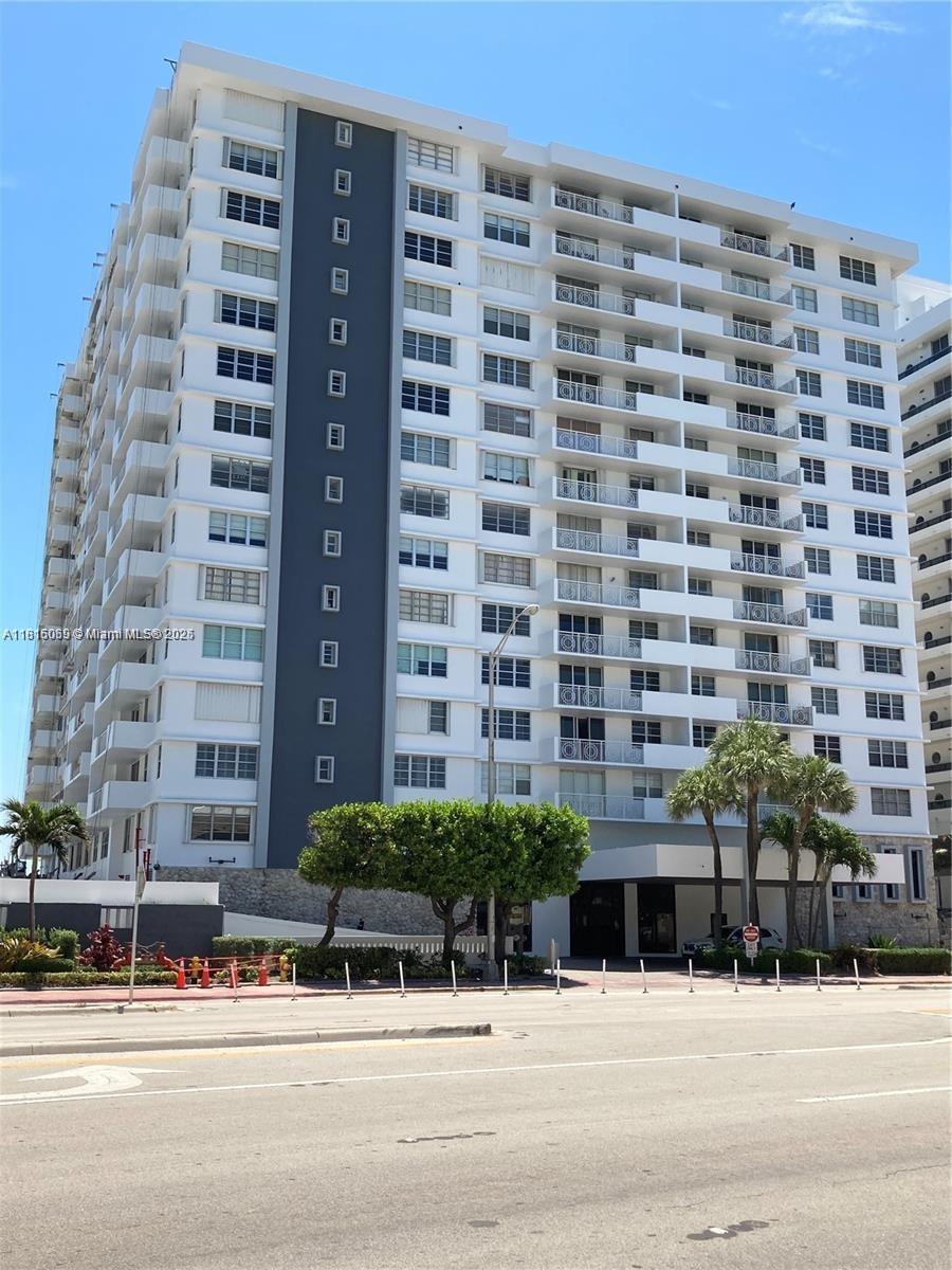 Corinthian Condominiums Miami Beach, FL 33140 - Photo 17 of 19 a tall building sitting on the side of a street