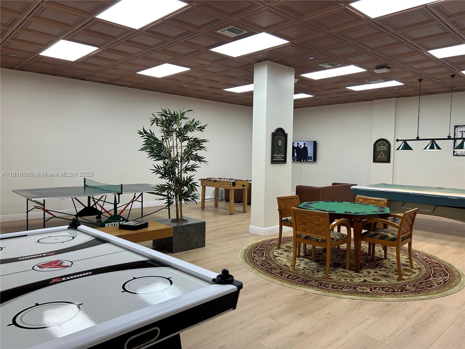 Corinthian Condominiums Miami Beach, FL 33140 - Photo 18 of 19 a room with table and chairs