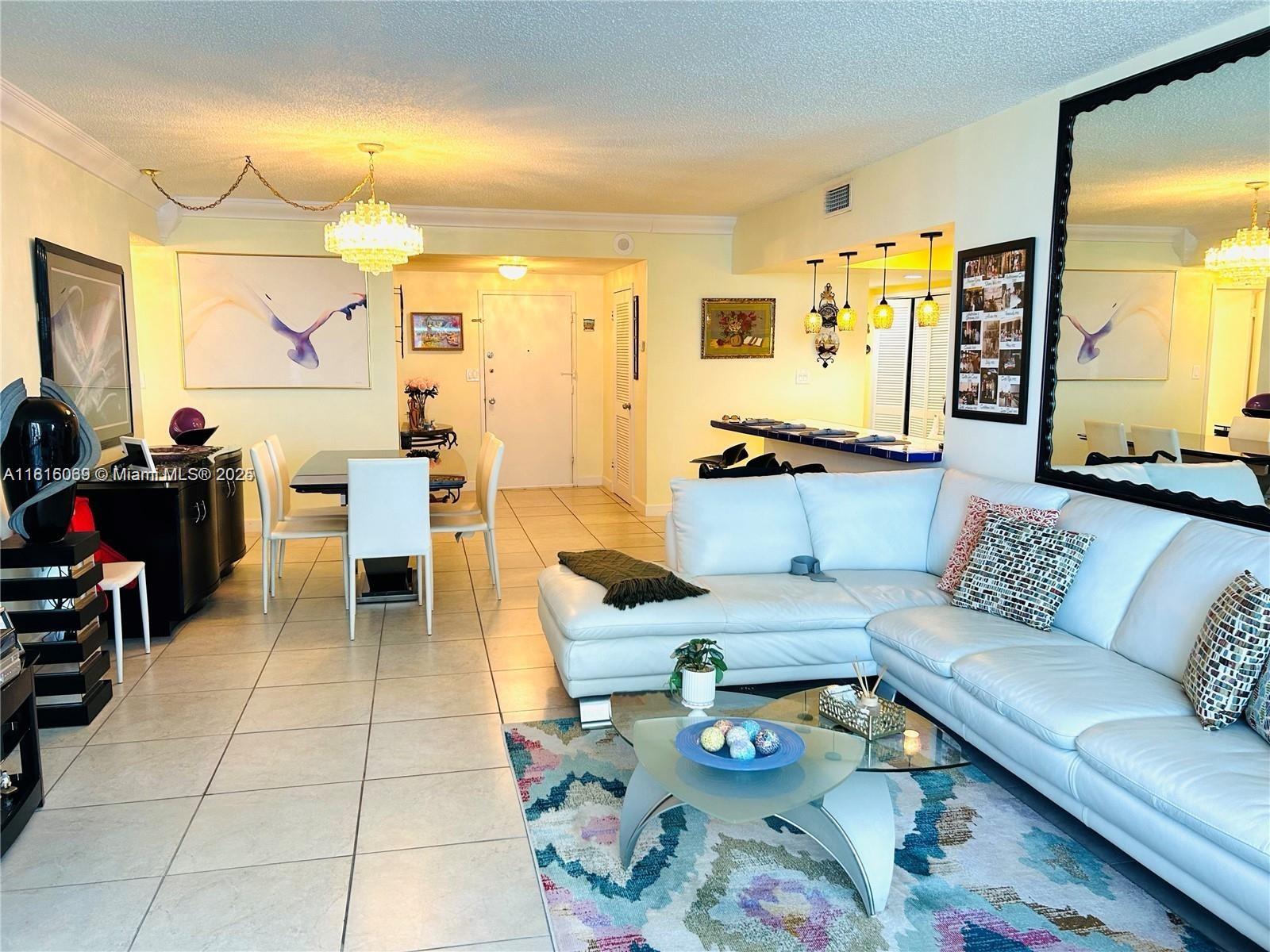 Corinthian Condominiums Miami Beach, FL 33140 - Photo 9 of 19 a living room with furniture and wooden floor