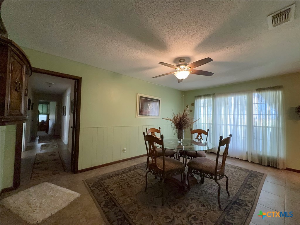 2834 Highway 238 Port Lavaca, TX 77979 - Photo 11 of 45 a view of a dining room with furniture and chandelier