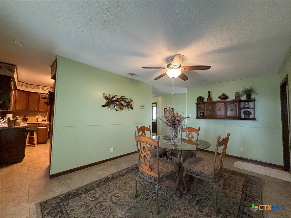 2834 Highway 238 Port Lavaca, TX 77979 - Photo 12 of 45 a view of a dining room with furniture and wooden floor