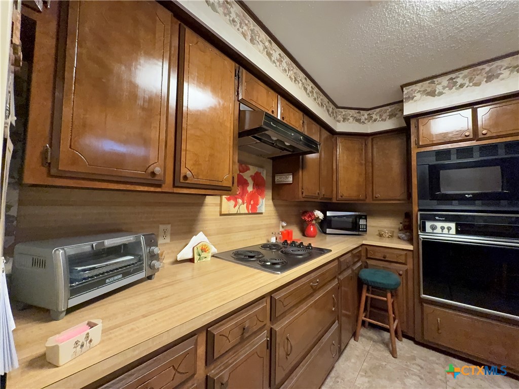 2834 Highway 238 Port Lavaca, TX 77979 - Photo 15 of 45 a kitchen with a stove and a microwave