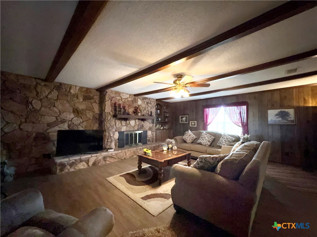 2834 Highway 238 Port Lavaca, TX 77979 - Photo 19 of 45 a living room with furniture a flat screen tv and a large window