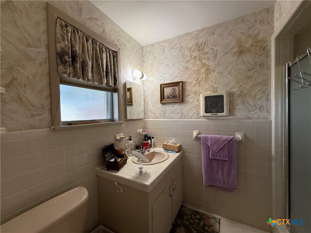 2834 Highway 238 Port Lavaca, TX 77979 - Photo 29 of 45 a bathroom with a sink toilet and mirror