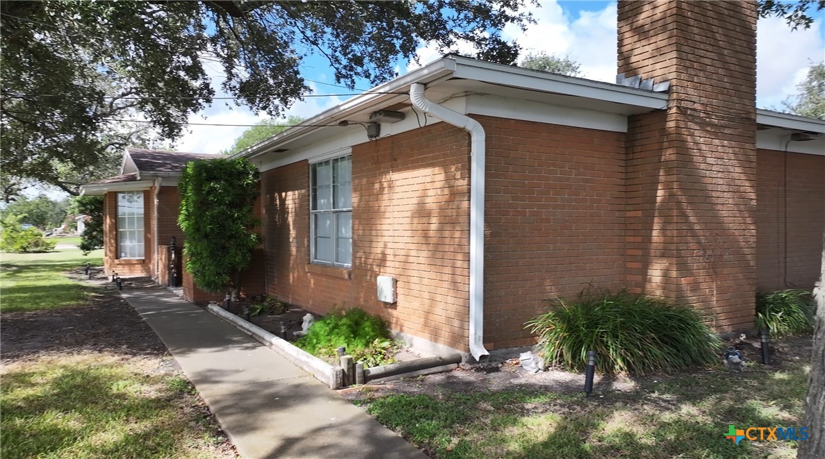 2834 Highway 238 Port Lavaca, TX 77979 - Photo 3 of 45 a front view of a house with a yard and potted plants