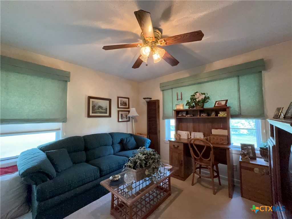 2834 Highway 238 Port Lavaca, TX 77979 - Photo 32 of 45 a living room with furniture and a chandelier