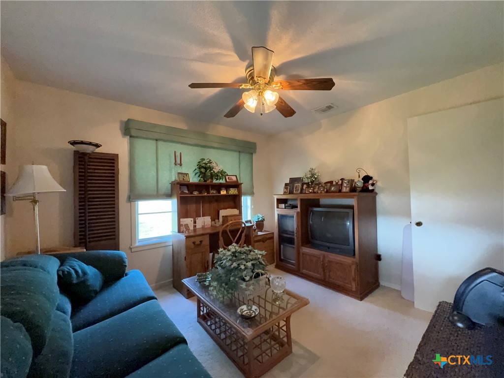 2834 Highway 238 Port Lavaca, TX 77979 - Photo 33 of 45 a living room with furniture and a fireplace