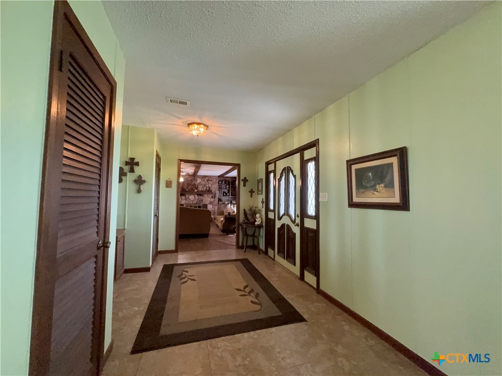 2834 Highway 238 Port Lavaca, TX 77979 - Photo 9 of 45 a view of a hallway with paintings on the wall