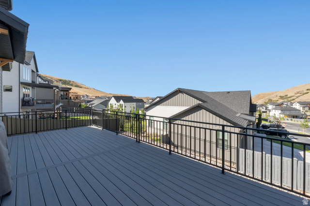 1711 West Canyon Rim Road North Lehi, UT 84048 - Photo 27 of 31 Expansive outdoor deck featuring composite decking and black metal railings