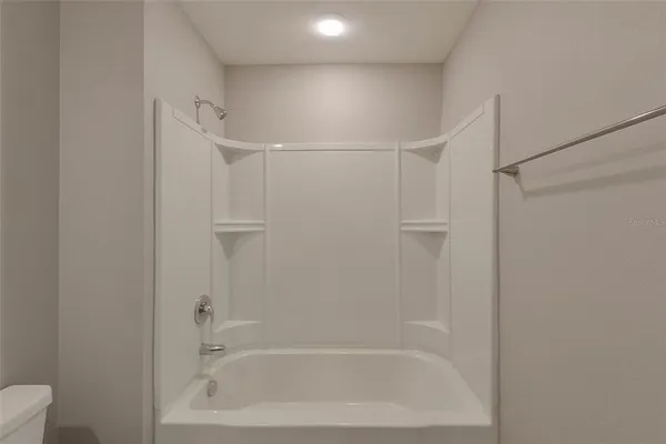 a close view of a bathtub in bathroom