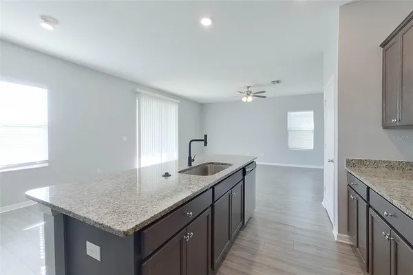a kitchen with a stove and a sink