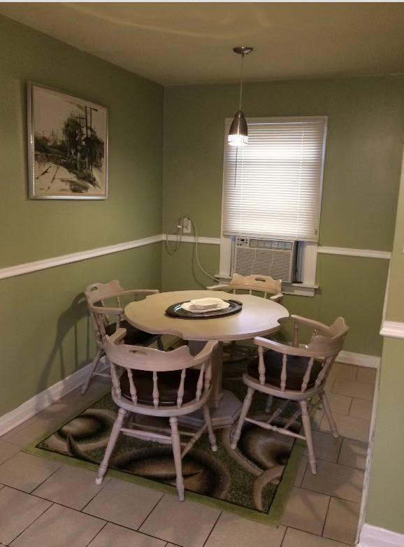5138 South Wabash Avenue, Unit 3 Chicago, IL 60615 - Photo 3 of 5 a view of a dining room with furniture and window