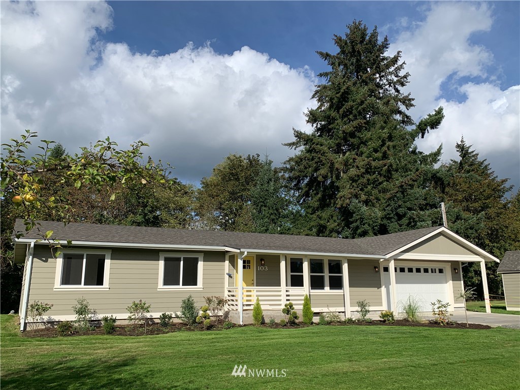 front view of a house with a yard