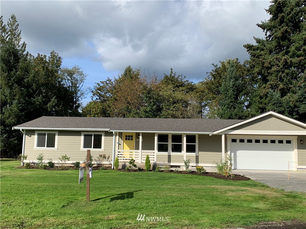 103 Eadon Road Toledo, WA 98591 - Photo 2 of 26 a front view of a house with a garden and yard