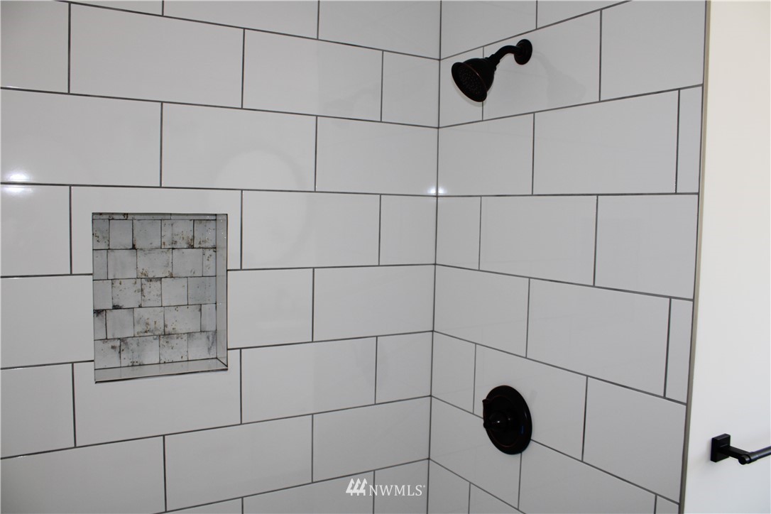 103 Eadon Road Toledo, WA 98591 - Photo 14 of 26 a bathroom with a shower