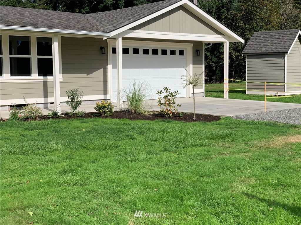 103 Eadon Road Toledo, WA 98591 - Photo 3 of 26 a front view of a house with a yard
