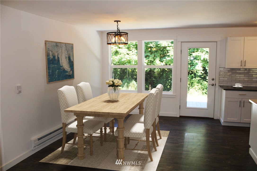 103 Eadon Road Toledo, WA 98591 - Photo 8 of 26 a view of a dining room with furniture window and wooden floor