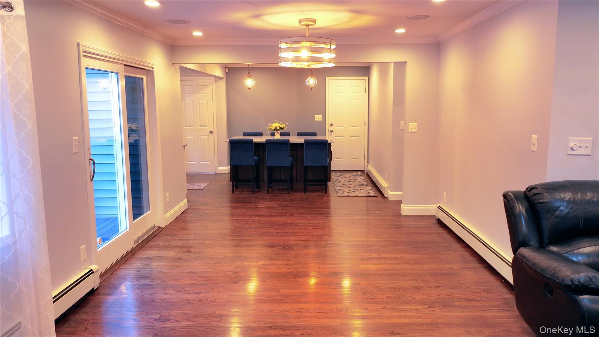 522 Moriches Road St. James, NY 11780 - Photo 11 of 49 a view of a hallway with furniture and wooden floor