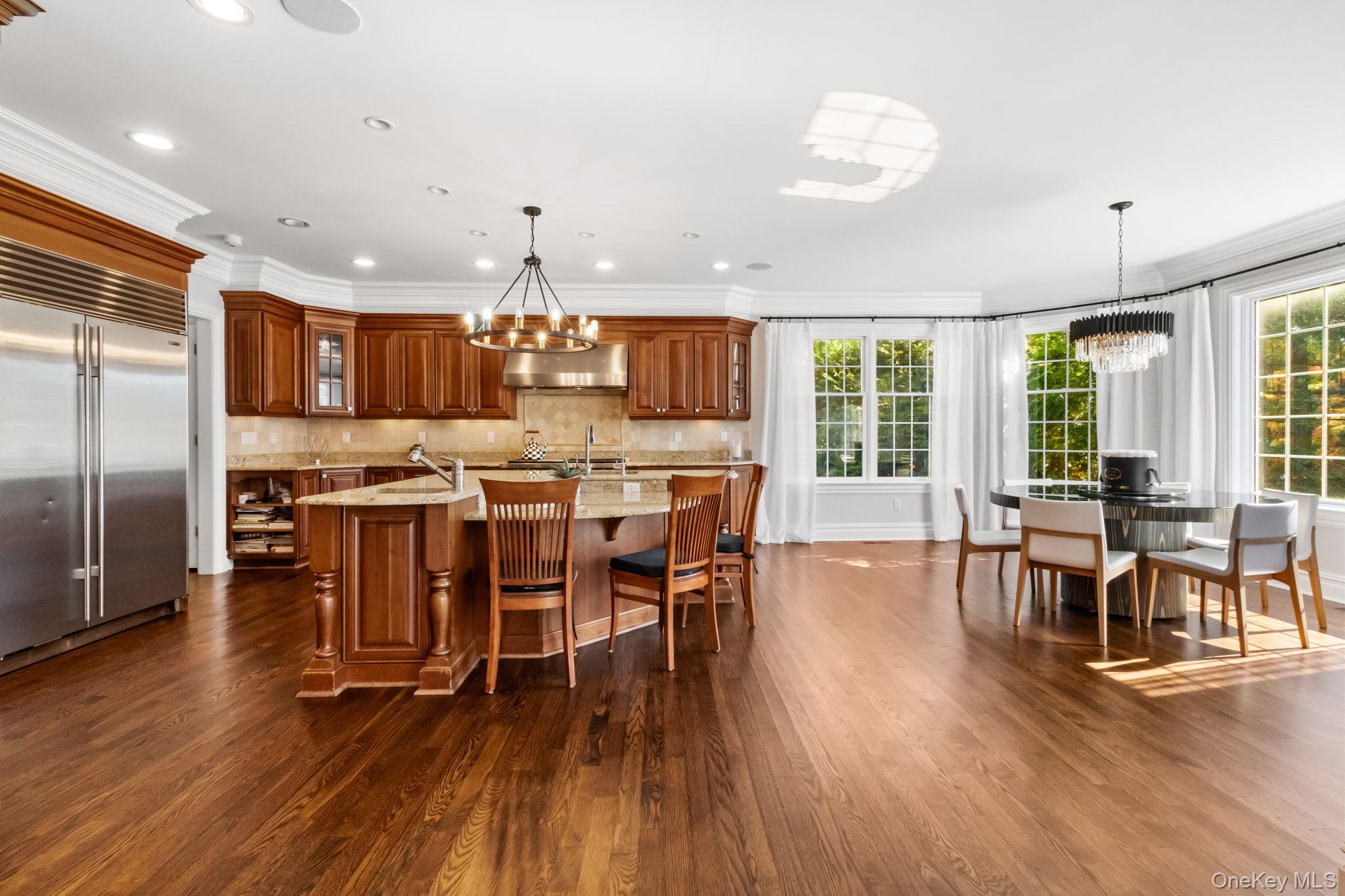 496 Long Ridge Road Bedford, NY 10576 - Photo 14 of 49 a view of a dining room with furniture kitchen and chandelier