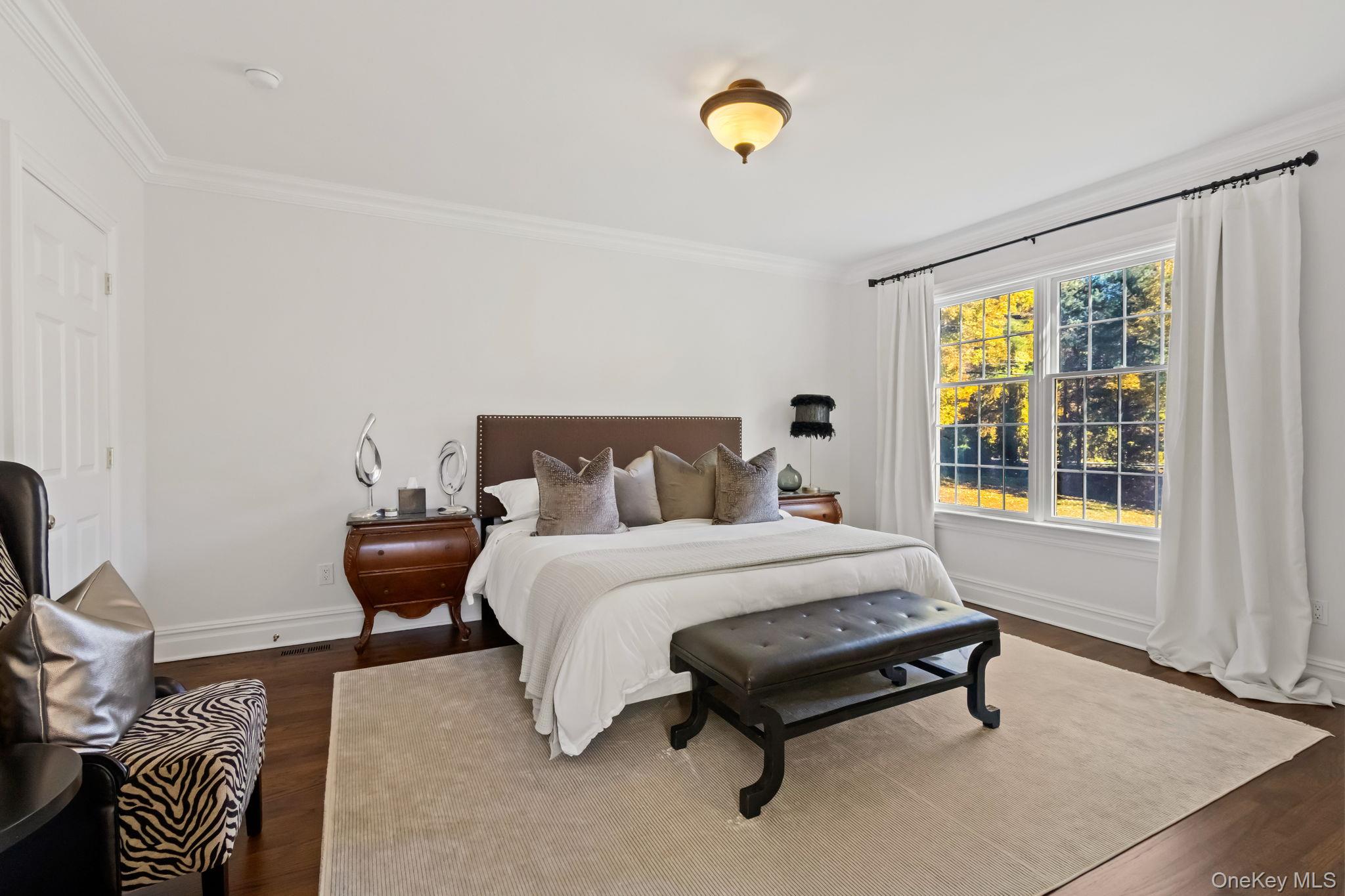 496 Long Ridge Road Bedford, NY 10576 - Photo 20 of 49 a spacious bedroom with a bed and a window