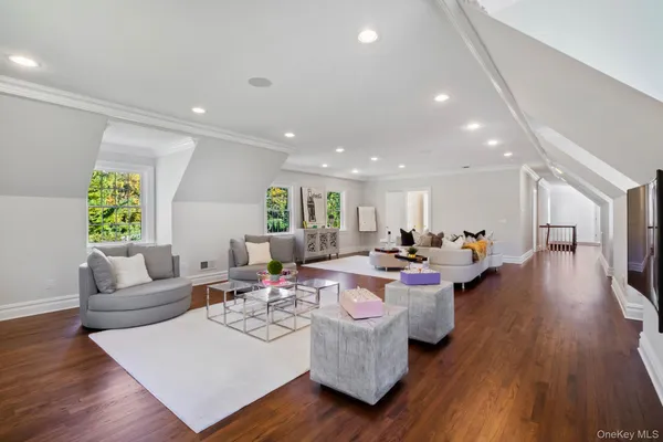 a living room with fireplace furniture and a wooden floor