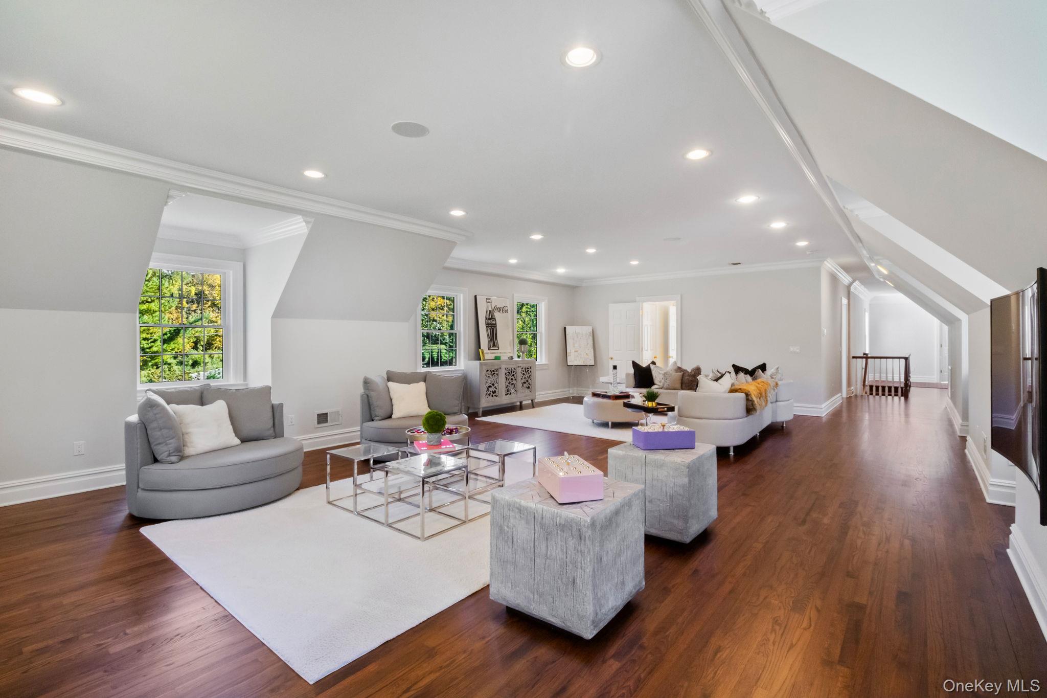 496 Long Ridge Road Bedford, NY 10576 - Photo 33 of 49 a living room with fireplace furniture and a wooden floor