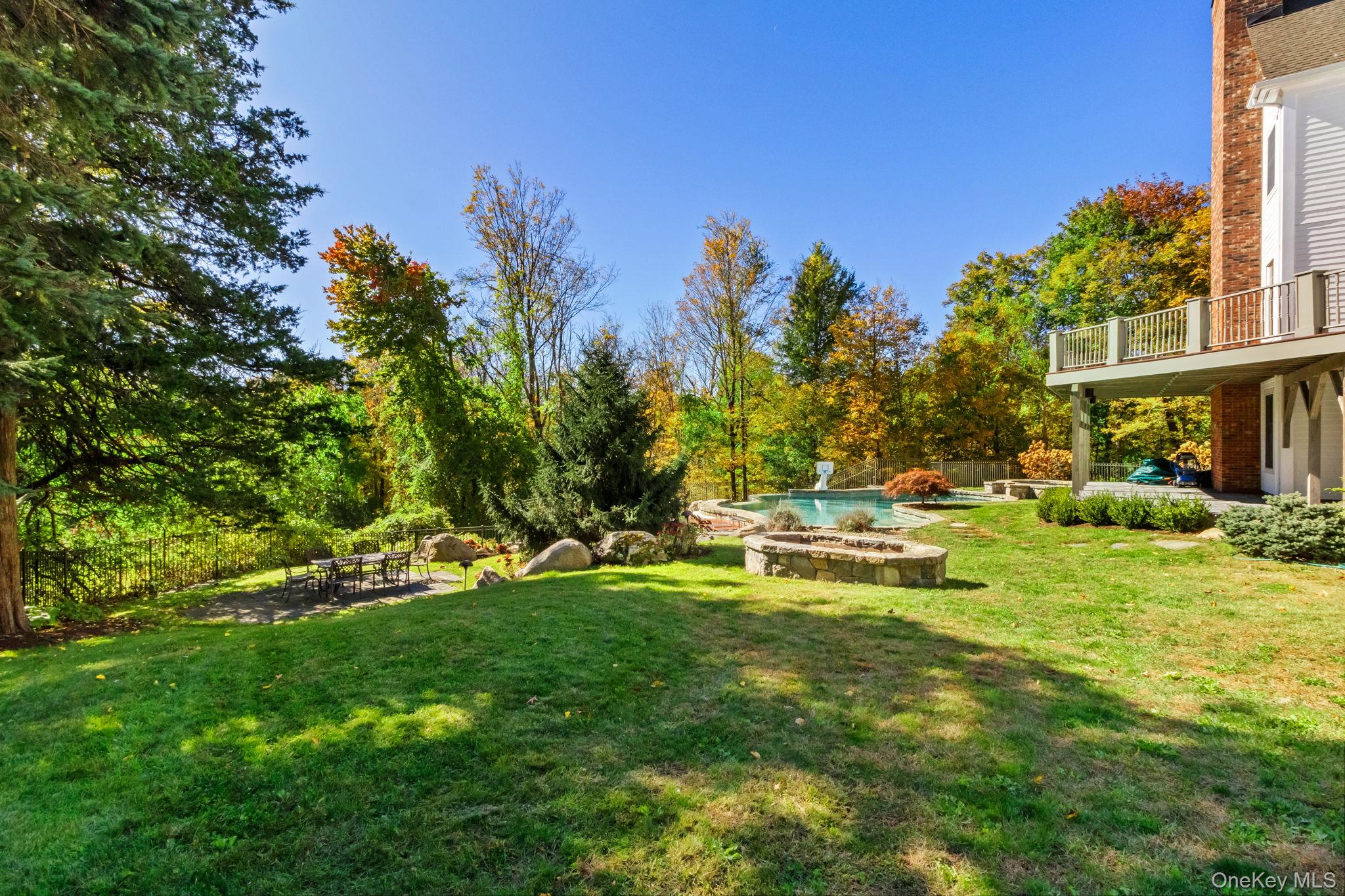 496 Long Ridge Road Bedford, NY 10576 - Photo 45 of 49 a view of a house with a yard