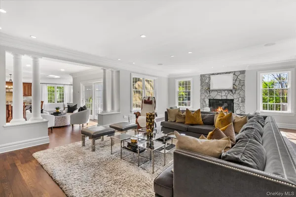 a living room with furniture couches and a fireplace