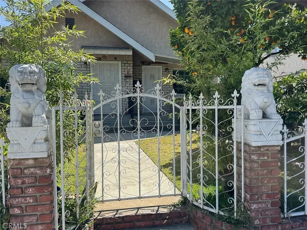 front view of a house with a garden