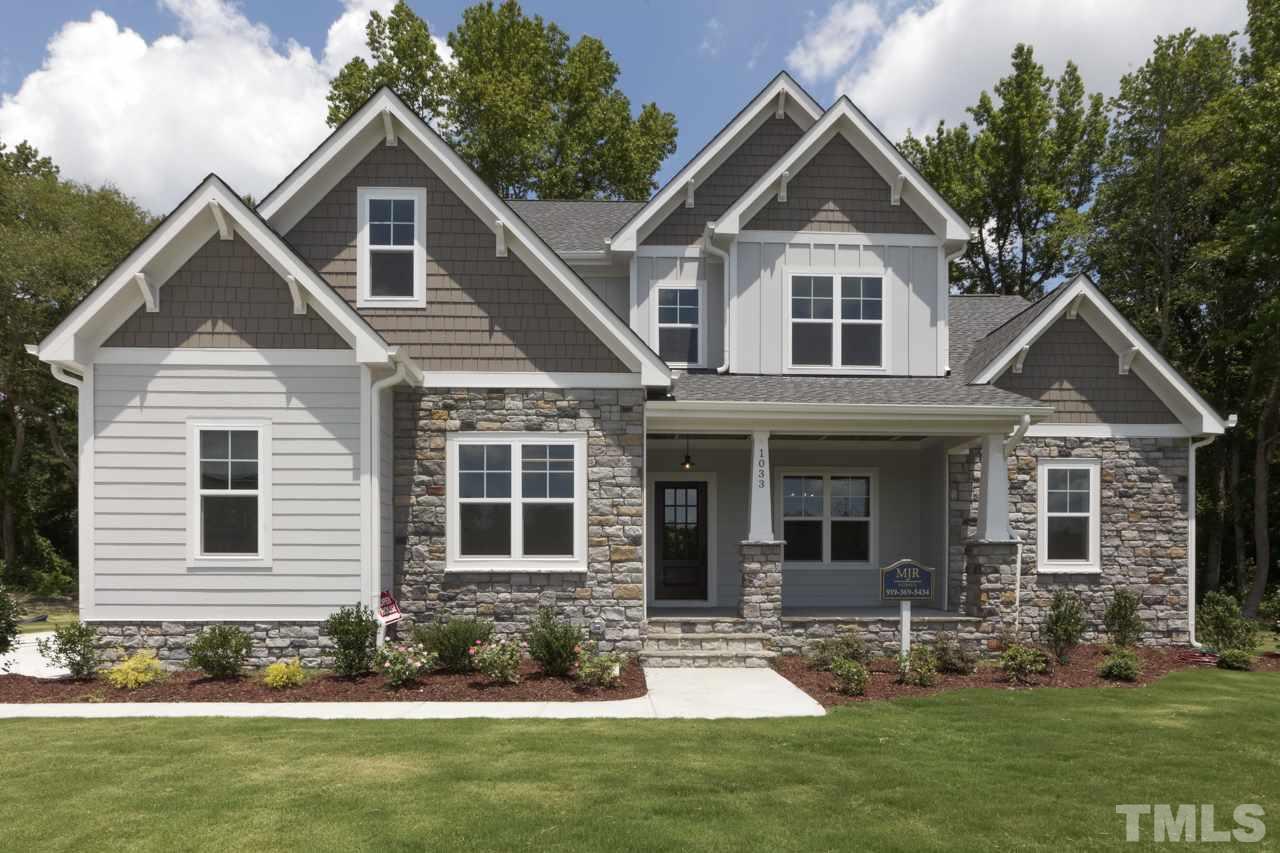 1033 Sky Wave Trail, Unit 8 Raleigh, NC 27603 - Photo 1 of 23 a front view of a house with a yard