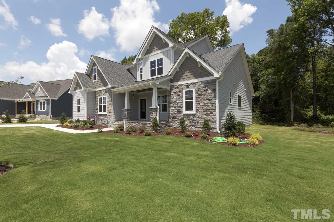 1033 Sky Wave Trail, Unit 8 Raleigh, NC 27603 - Photo 2 of 23 a front view of a house with a yard