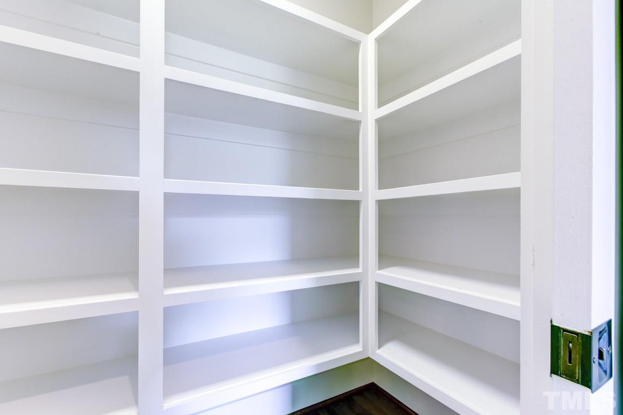 1033 Sky Wave Trail, Unit 8 Raleigh, NC 27603 - Photo 17 of 23 a view of walk in closet with empty racks