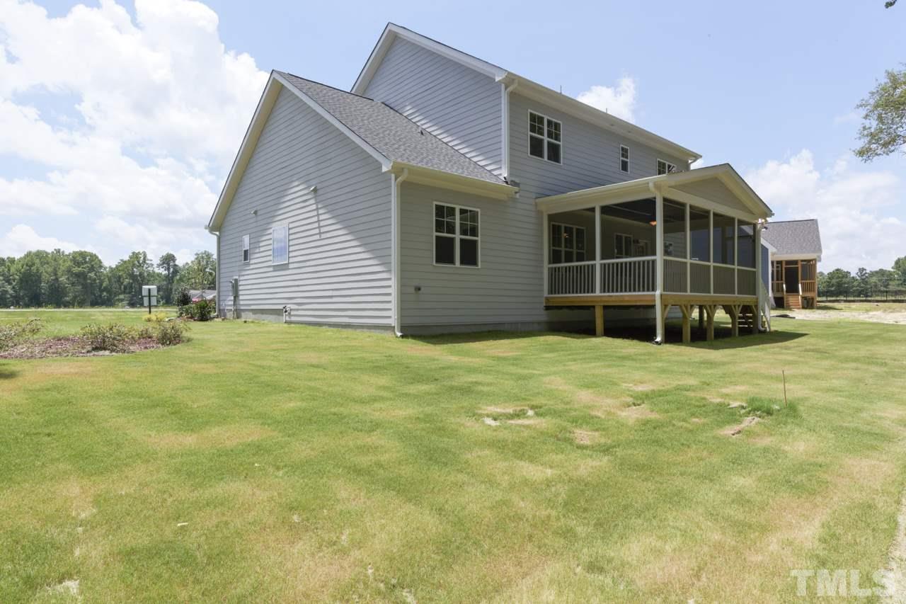 1033 Sky Wave Trail, Unit 8 Raleigh, NC 27603 - Photo 3 of 23 a view of a house with a yard