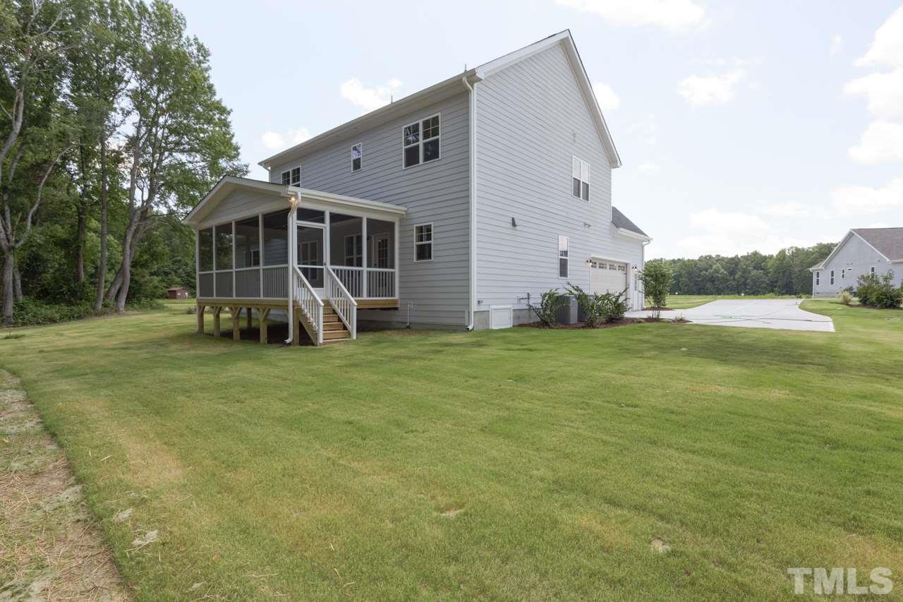 1033 Sky Wave Trail, Unit 8 Raleigh, NC 27603 - Photo 22 of 23 a view of a house with backyard and porch