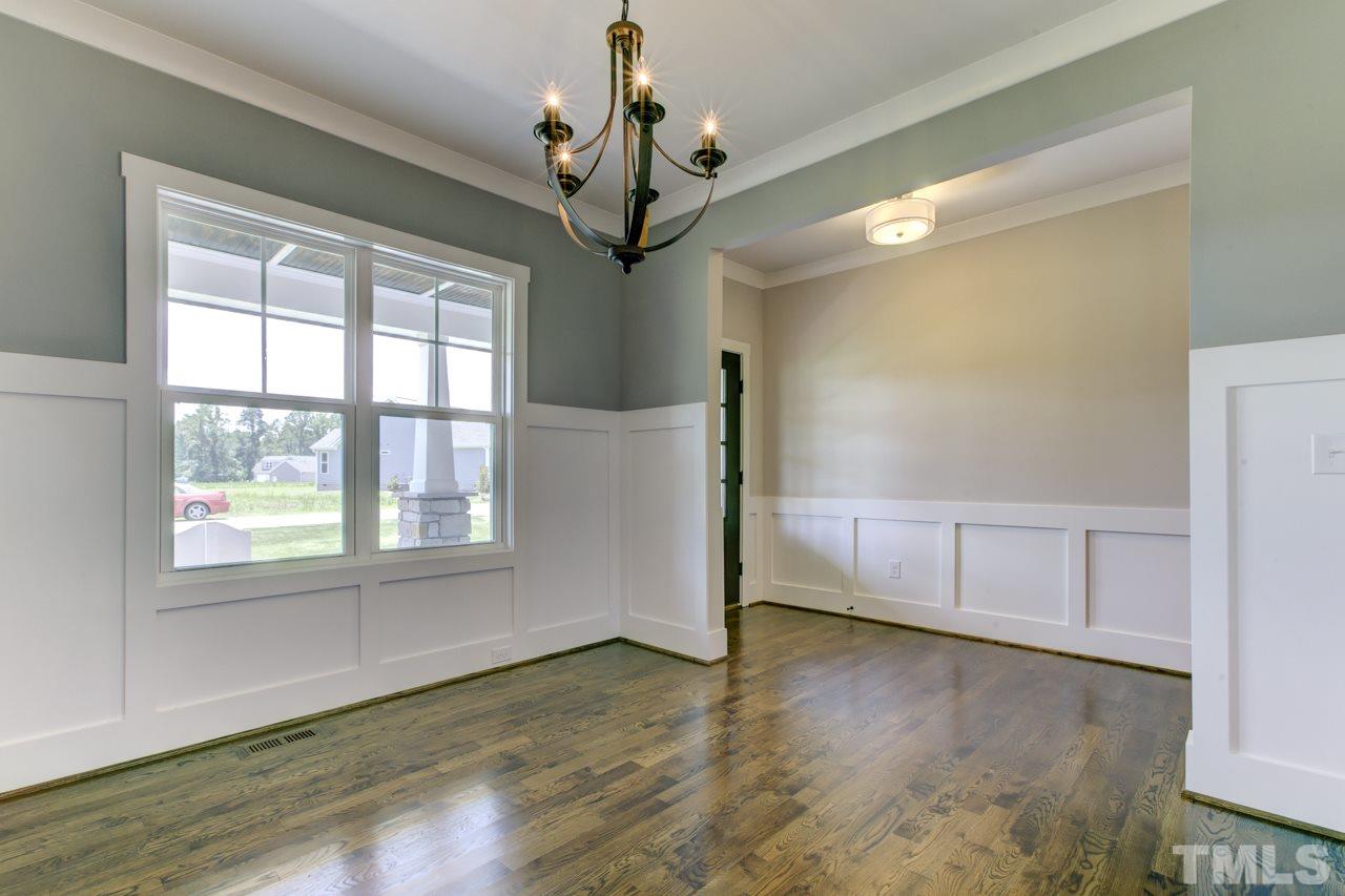 1033 Sky Wave Trail, Unit 8 Raleigh, NC 27603 - Photo 23 of 23 a view of a room with wooden floor and windows