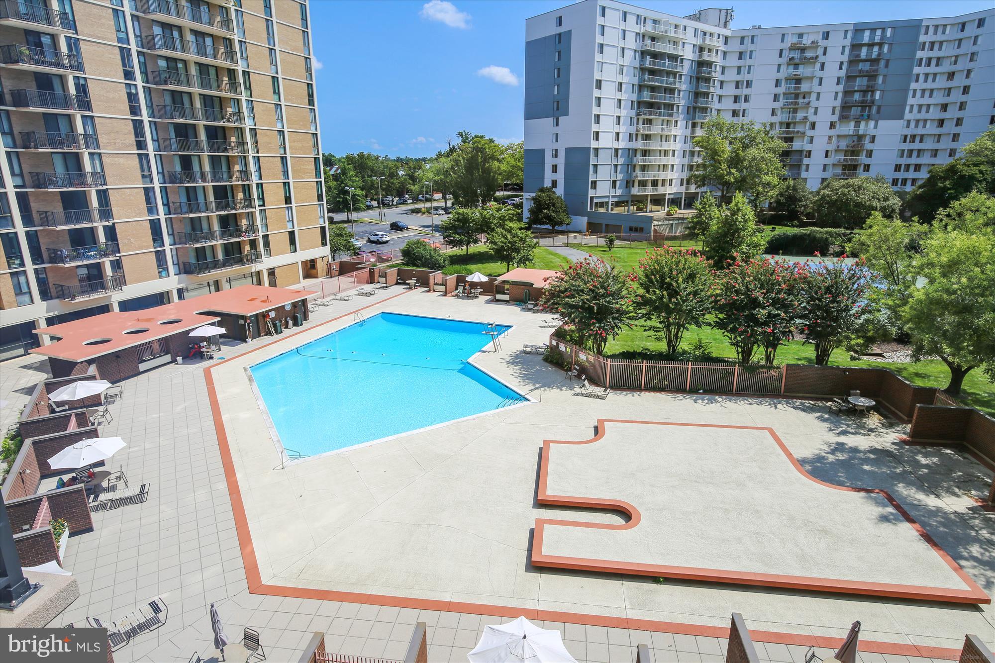 6800 Fleetwood Road, Unit 1004 McLean, VA 22101 - Photo 21 of 40 Sunny oasis with a sparkling pool retreat.