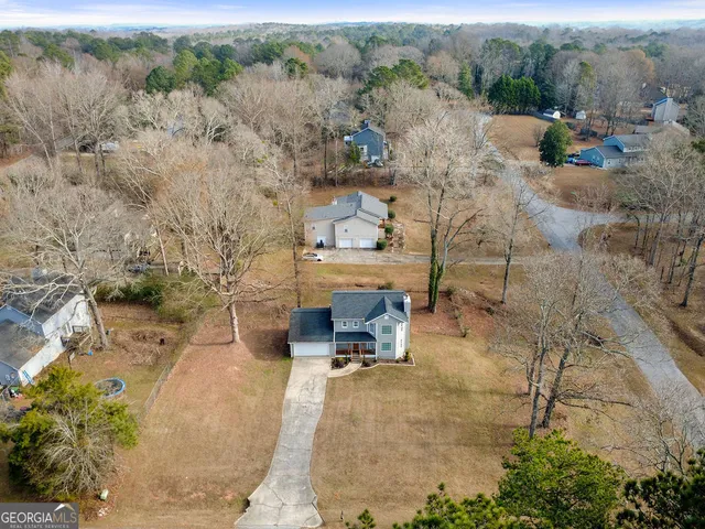 a view of a couches with wooden fence
