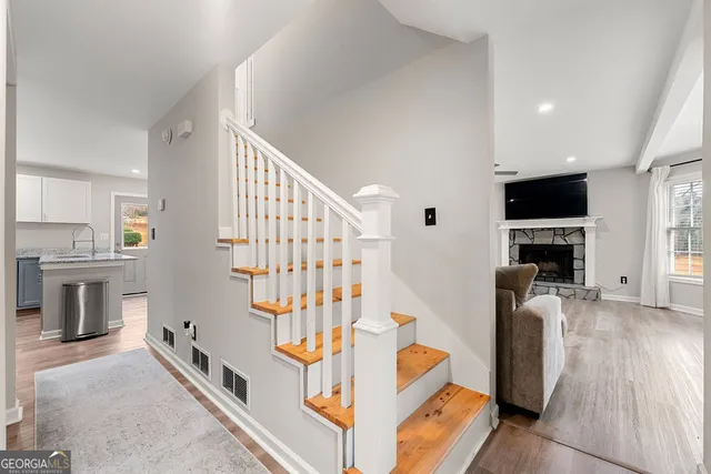 a living room with furniture fireplace and flat screen tv
