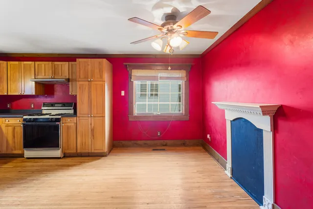 a view of a room with music instruments and a window