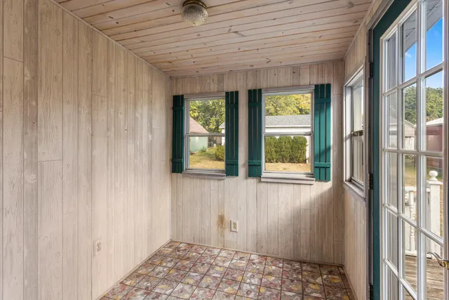a view of living room with furniture and windows