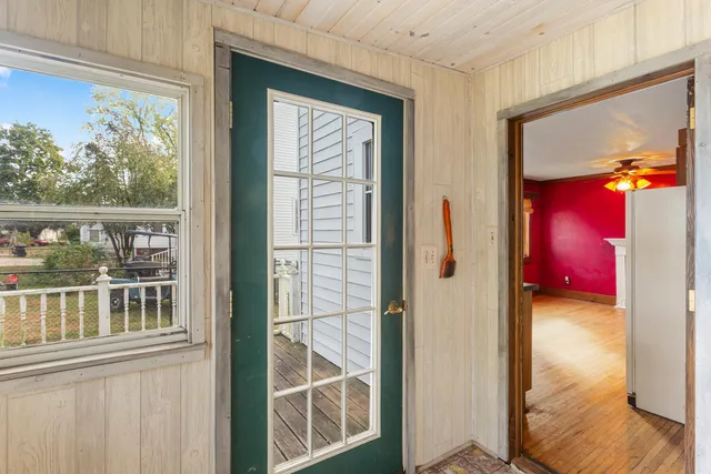 a bathroom with a toilet a sink and a mirror