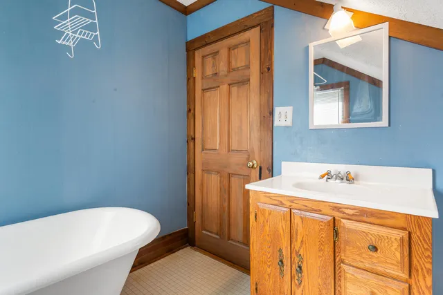 a white toilet sitting next to a bathroom sink