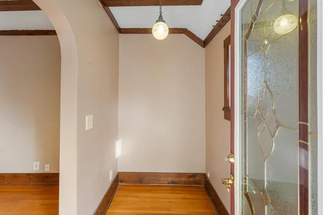 a view of an entryway with wooden floor