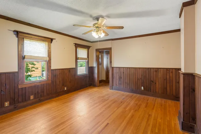 a view of livingroom with hardwood floor and a ceiling fan