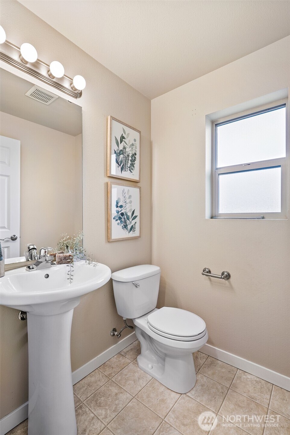 1900 Weaver Road, Unit E102 Snohomish, WA 98290 - Photo 11 of 19 a bathroom with a toilet a sink and mirror