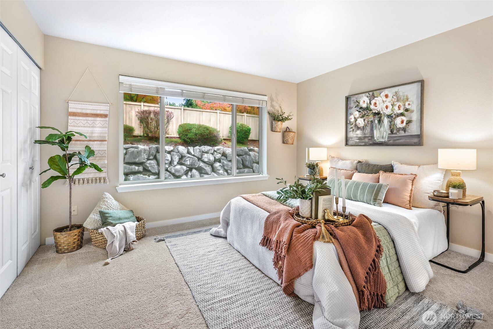 1900 Weaver Road, Unit E102 Snohomish, WA 98290 - Photo 12 of 19 a bed sitting in a bedroom next to a window