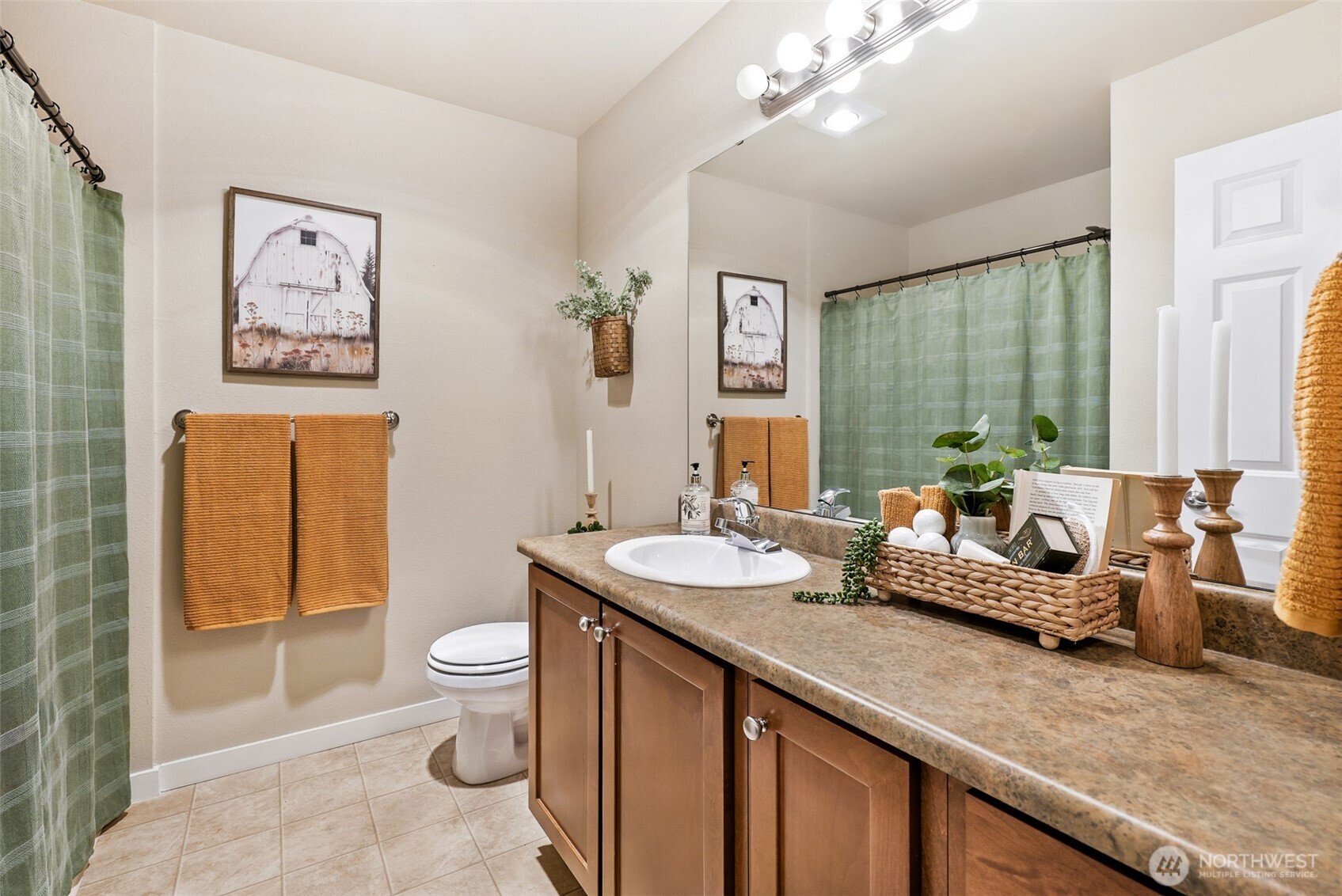 1900 Weaver Road, Unit E102 Snohomish, WA 98290 - Photo 15 of 19 a spacious bathroom with a granite countertop sink a toilet a mirror and shower