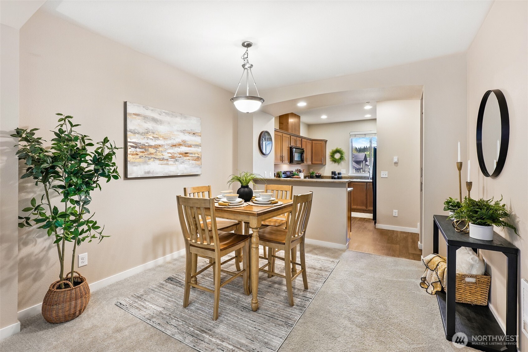 1900 Weaver Road, Unit E102 Snohomish, WA 98290 - Photo 8 of 19 a view of a dining room with furniture and a potted plant